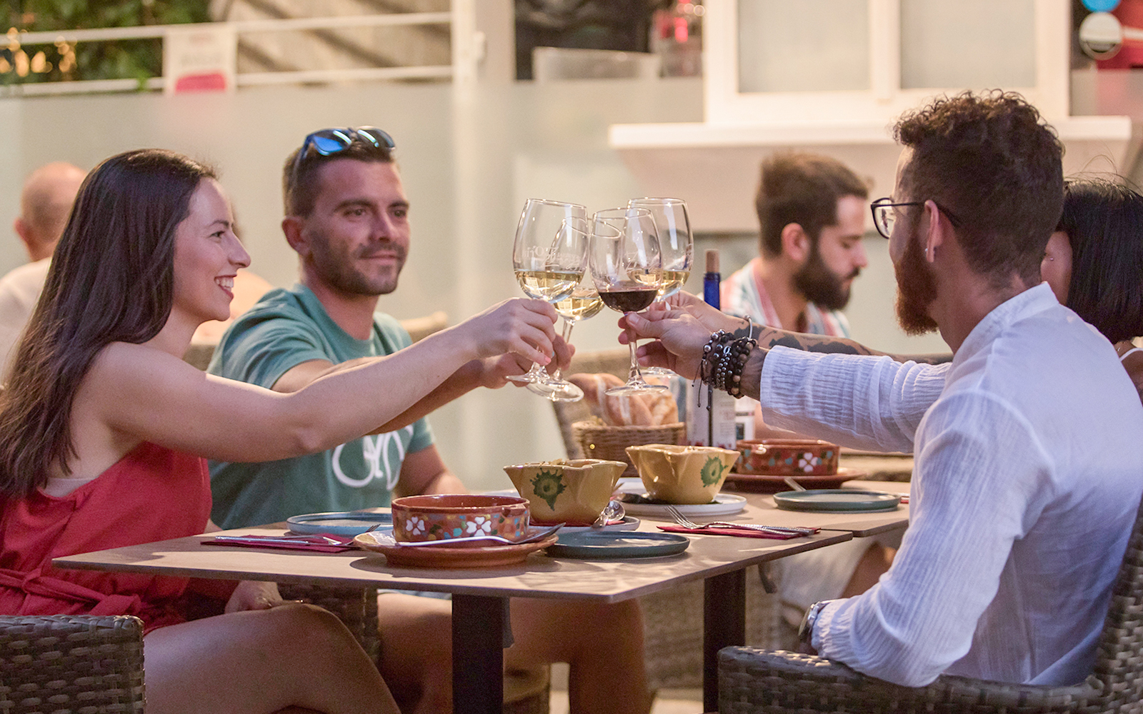 Group toasting with wine at Alegría Flamenco & Gastronomia dining experience.