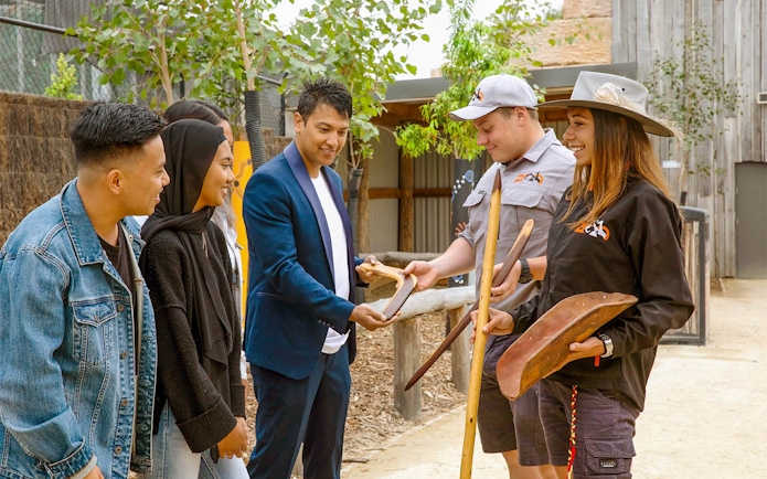 Sydney Zoo visitors learning about Aboriginal tools and culture.