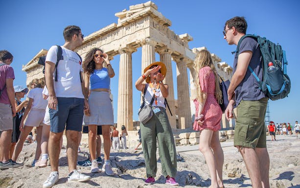 Tour group exploring the Parthenon in Athens, Greece.