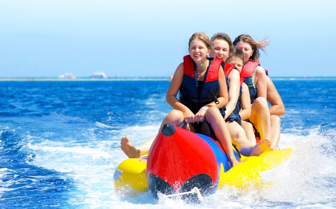 Group enjoying banana boat ride on Paradise Island tour from Hurghada.