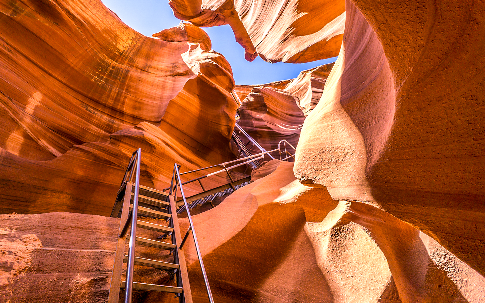 Staircase leading through Antelope Canyon's sandstone formations, Arizona.