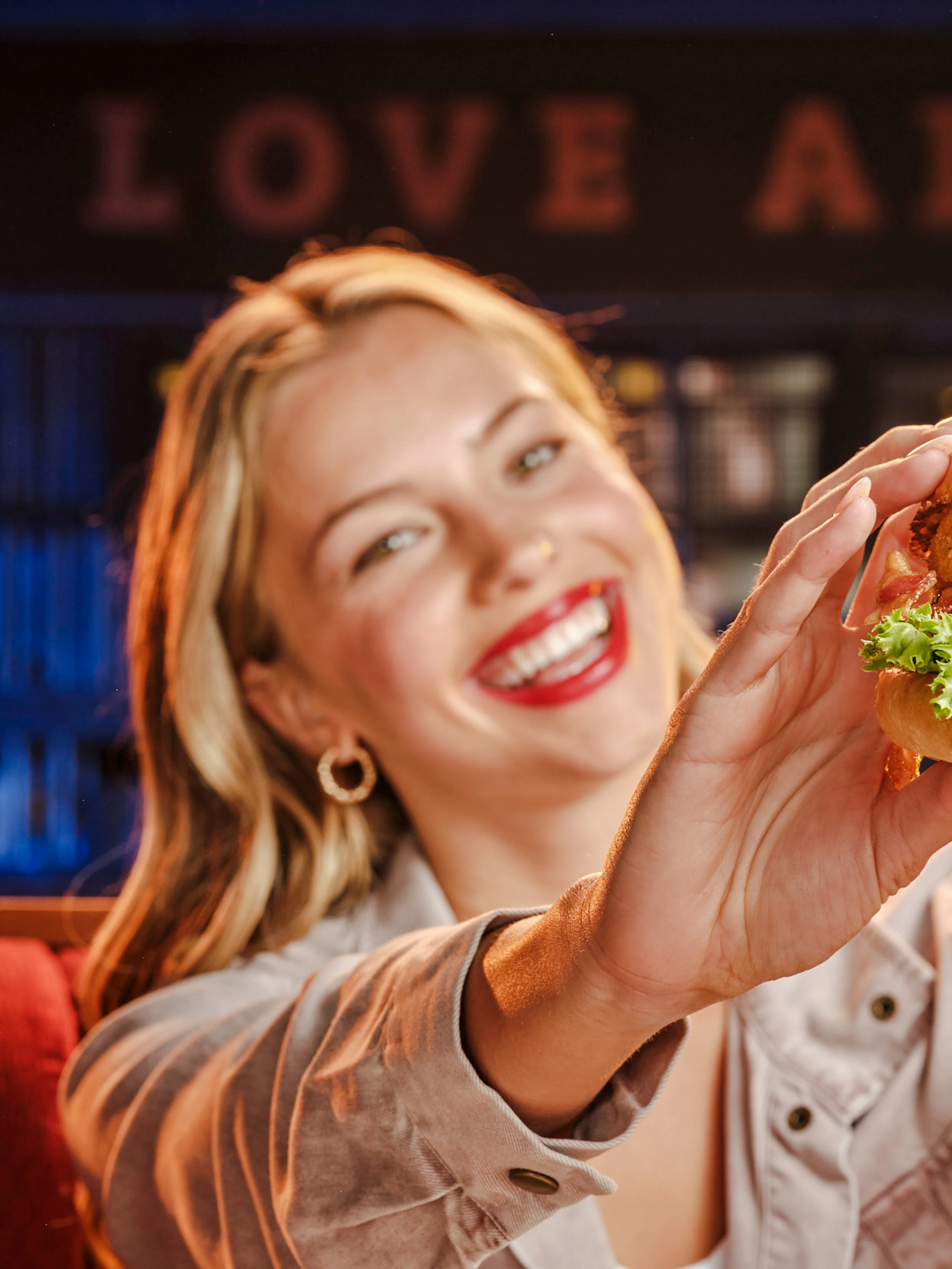 Burger with onion rings and lettuce at Hard Rock Cafe, Amsterdam.