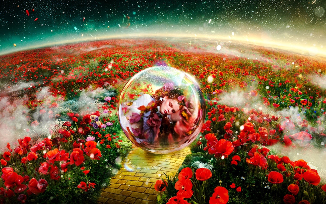 Yellow brick road through poppy field with a person in a bubble, Wizard of Oz at Sphere.