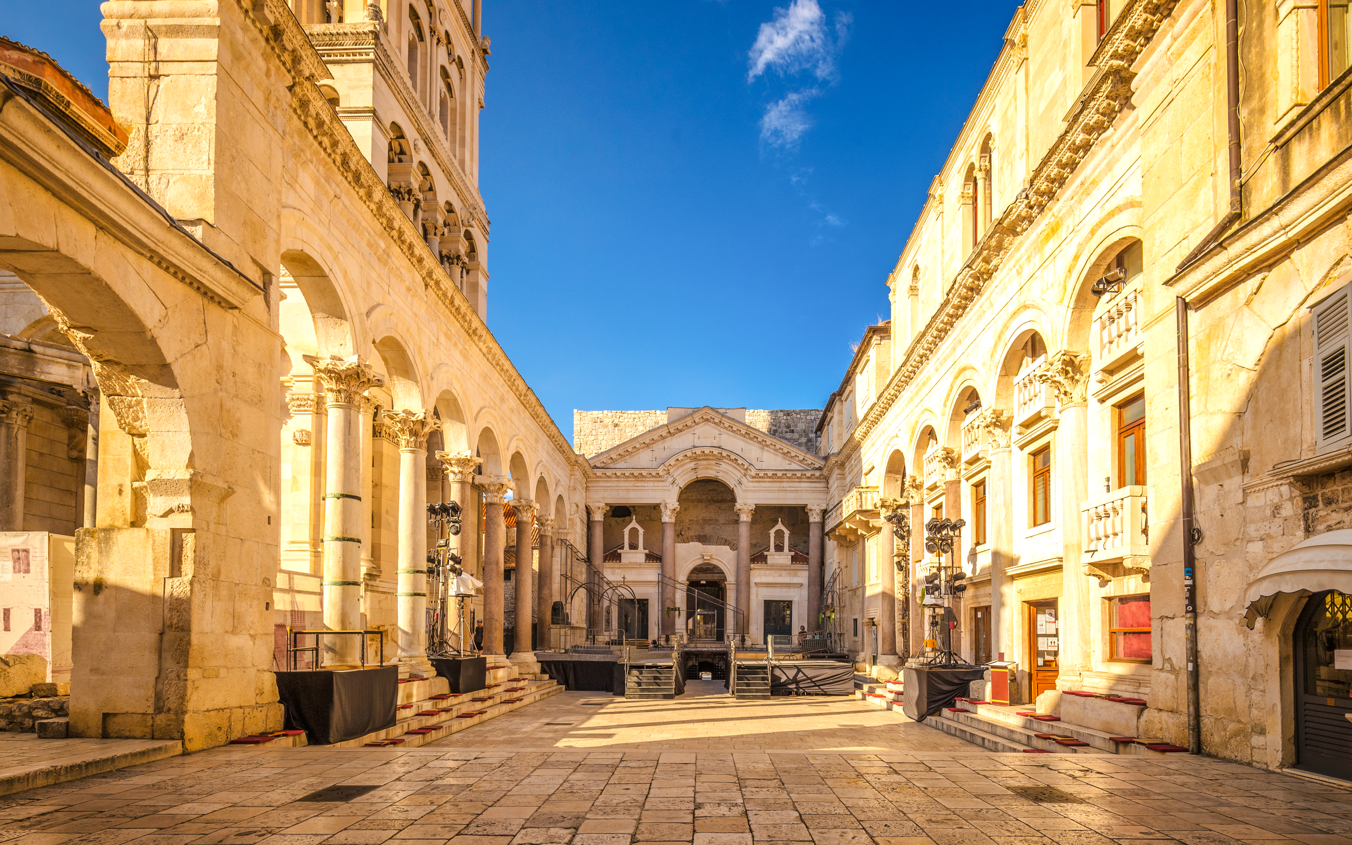 Peristyle square in Diocletian's Palace, Split, Croatia, featuring ancient columns and arches.