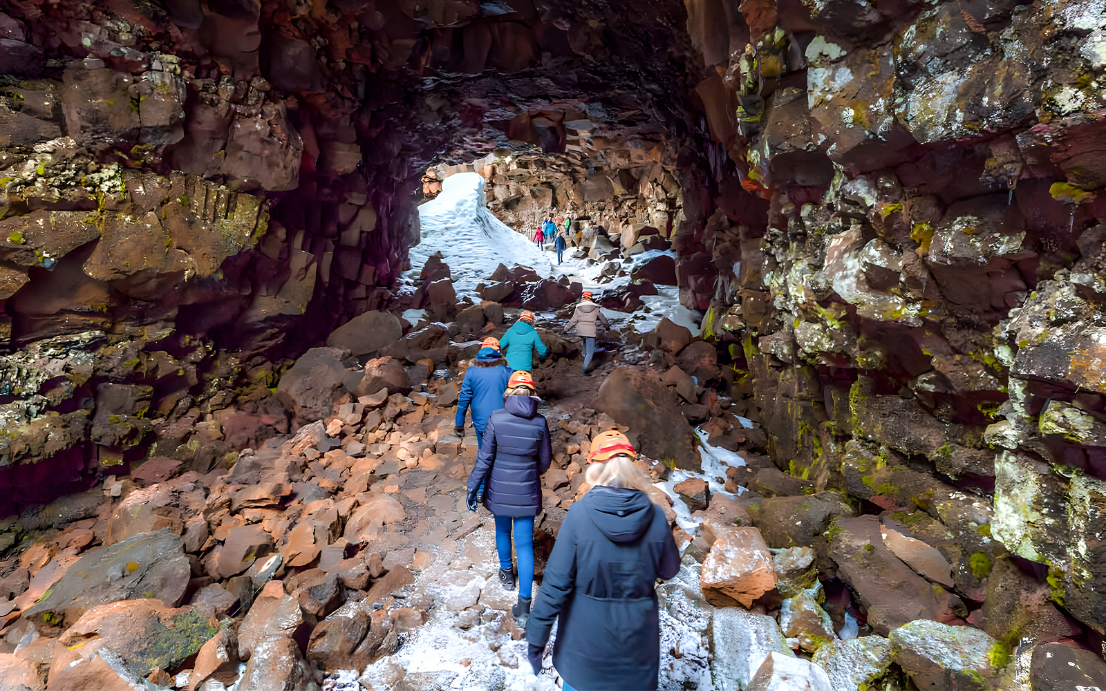 Guests exploring Raufarhólshellir Lava Cave in Iceland.