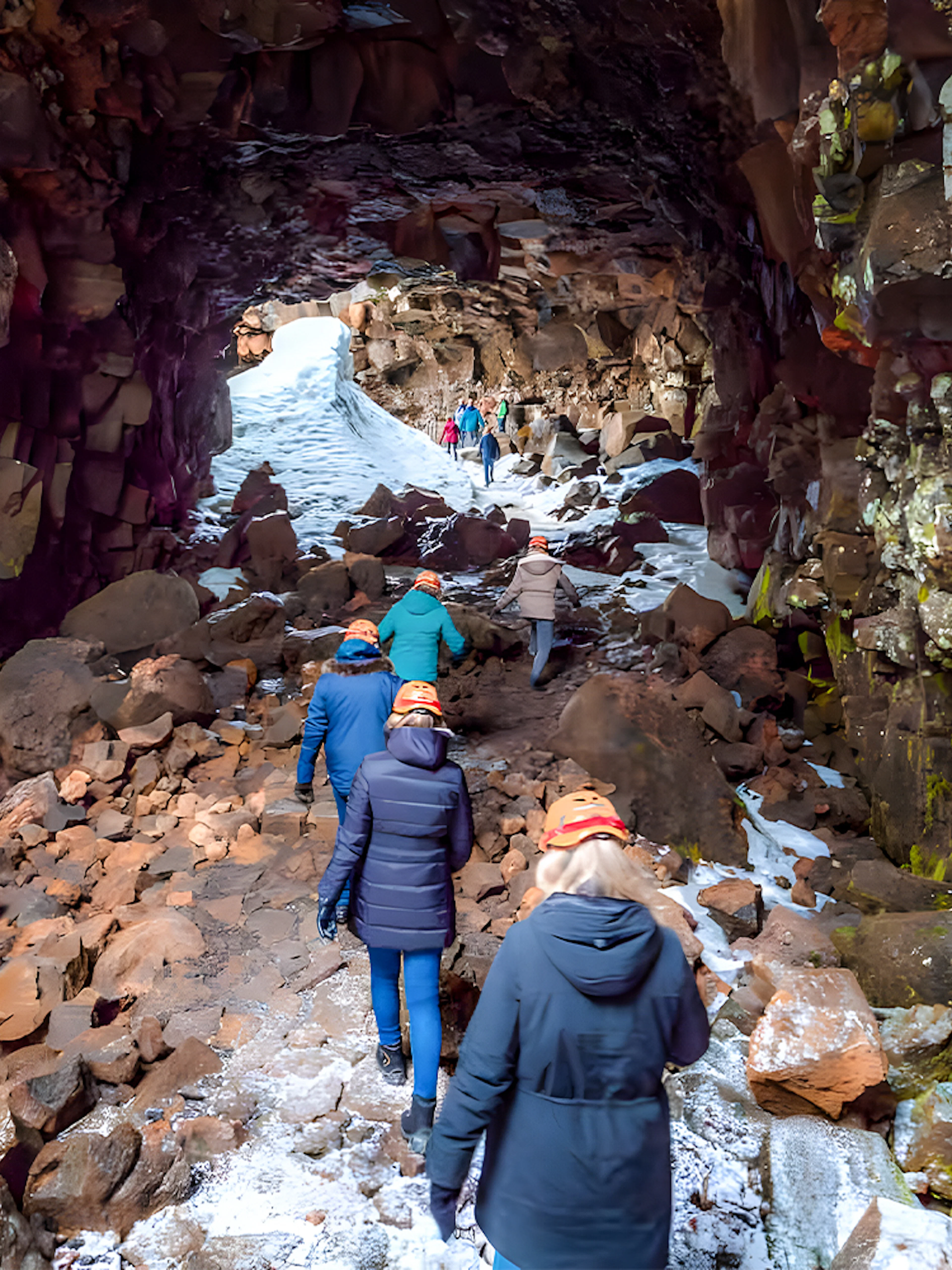 Guests exploring Raufarhólshellir Lava Cave in Iceland.