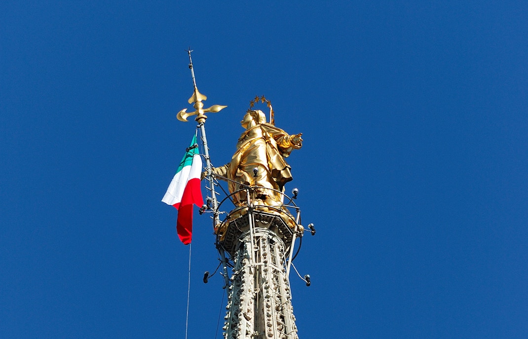 Statue of Madonnina with flag