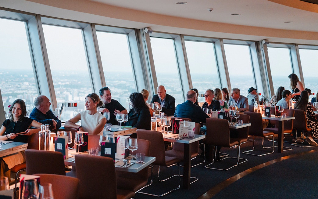 Dining at Berlin TV Tower with city view.
