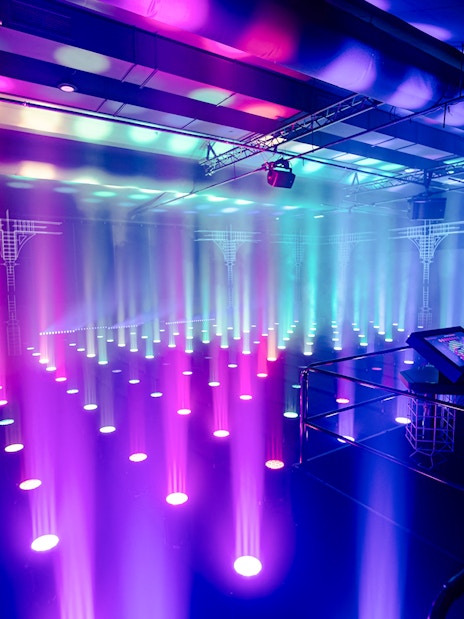Interactive light installation at Amaze Amsterdam with visitor using control panel.