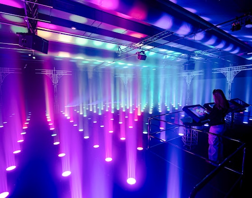 Interactive light installation at Amaze Amsterdam with visitor using control panel.