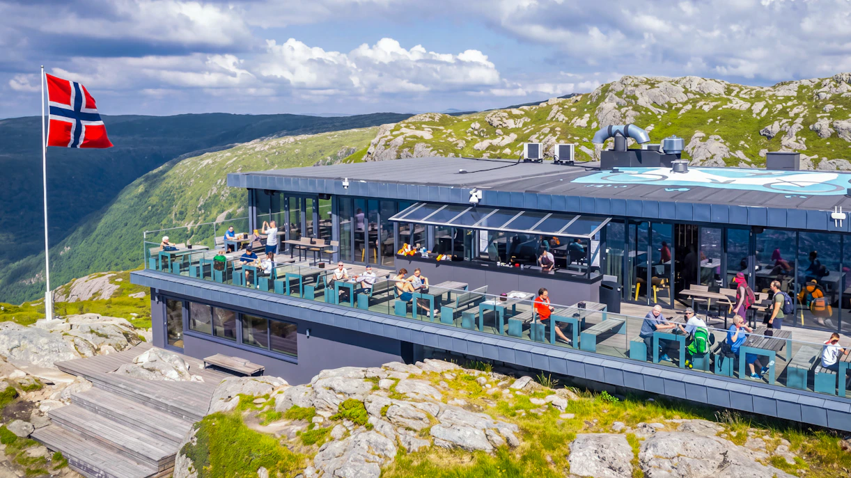 Skyskraperen Restaurant terrace with diners, Ulriken mountain view, Norway.