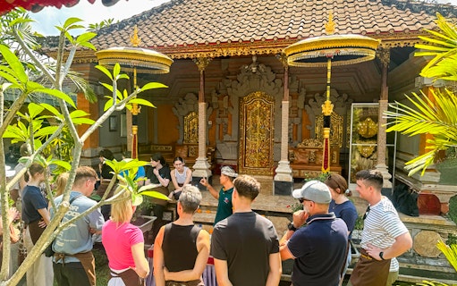 Group attending cooking class at traditional Balinese house in Ubud, Bali.