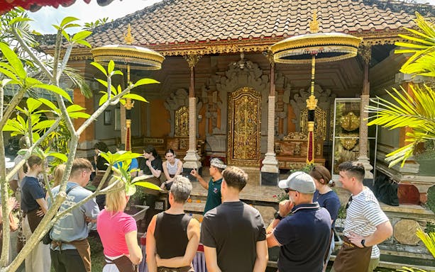 Group attending cooking class at traditional Balinese house in Ubud, Bali.