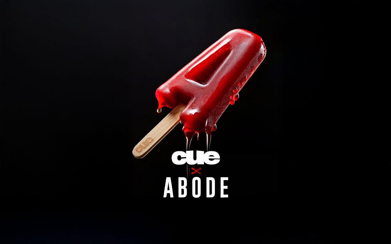 Red popsicle shaped like the letter A with Cue and Abode logos on a black background.
