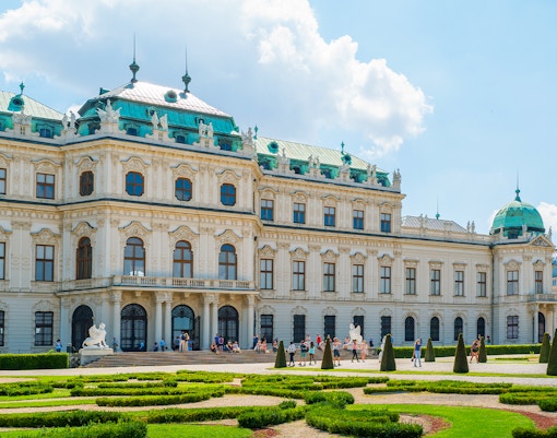 Belvedere Palace with gardens in Vienna, Austria, featuring baroque architecture and manicured hedges.