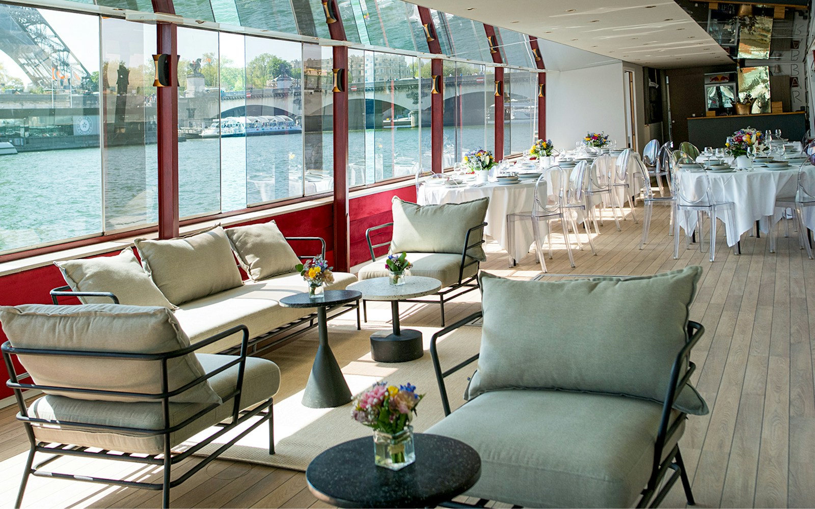 THEO Boat cruising on the Seine River in Paris with guests dining on Italian cuisine.