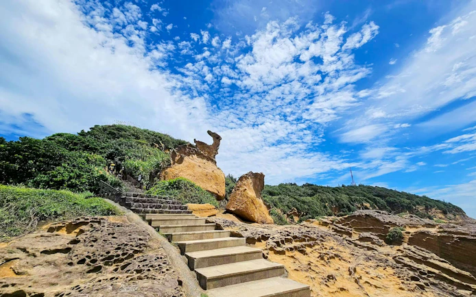 Stairs leading to Marine Bird Rock in Yehliu Geopark, Wanli District, Taiwan.