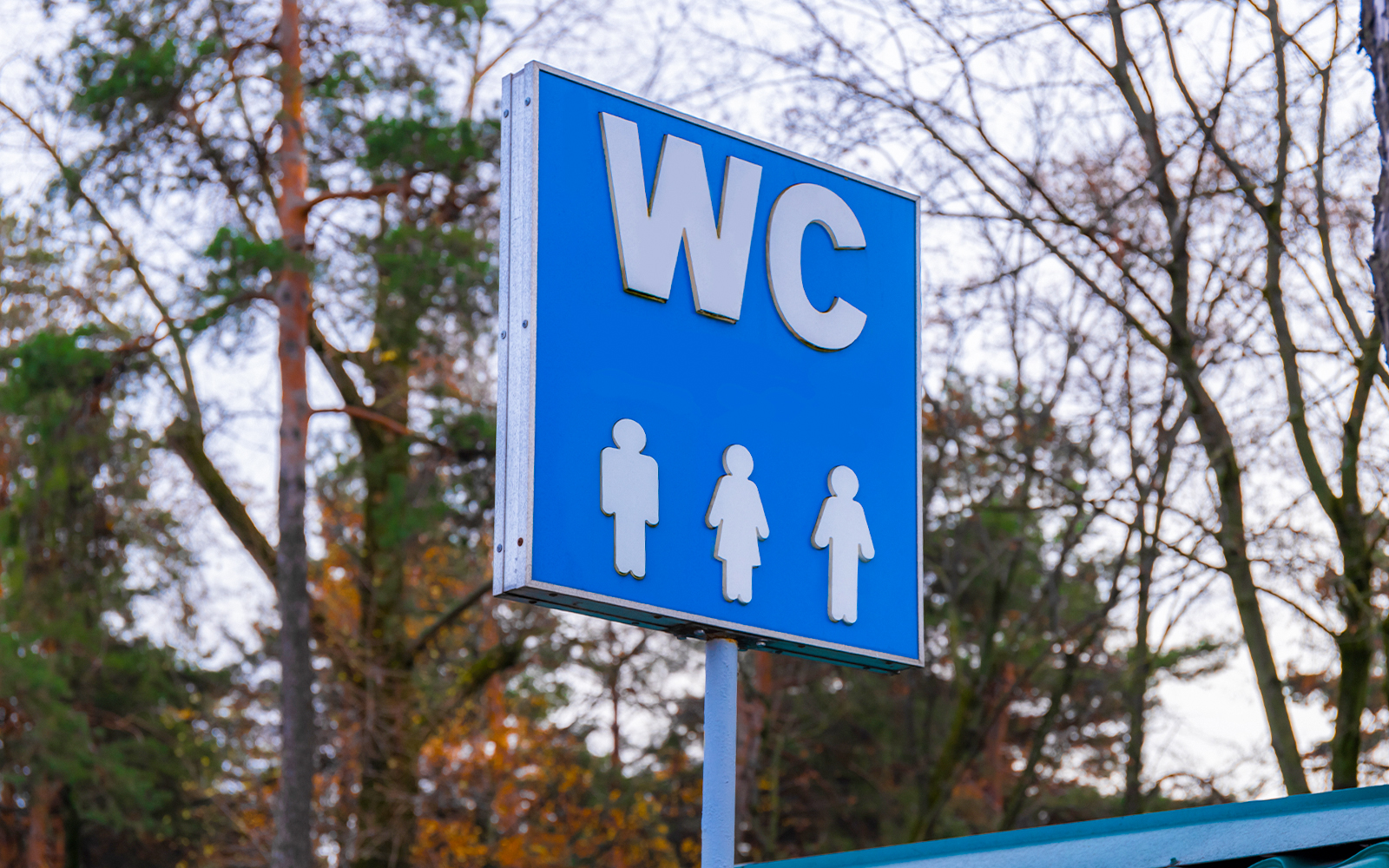 Restroom sign near Westminster Abbey with male and female symbols.