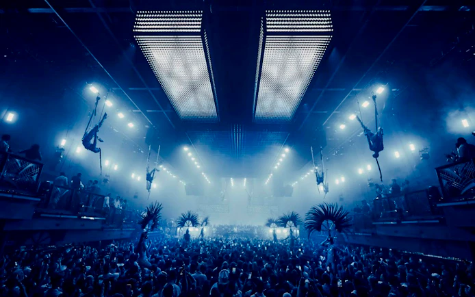 Aerial performers at UNVRS David Guetta Galactic Circus in Ibiza nightclub.