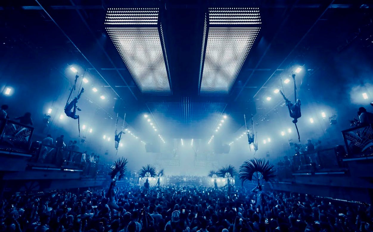 Aerial performers at UNVRS David Guetta Galactic Circus in Ibiza nightclub.