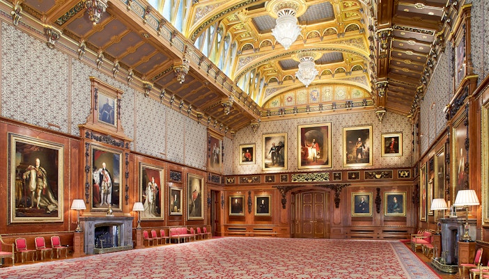 Waterloo Chamber in Windsor Castle with portraits and ornate ceiling.
