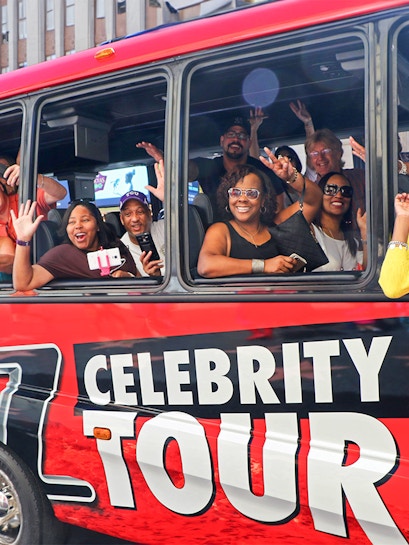 People enjoying TMZ Celebrity Tour bus in Los Angeles.
