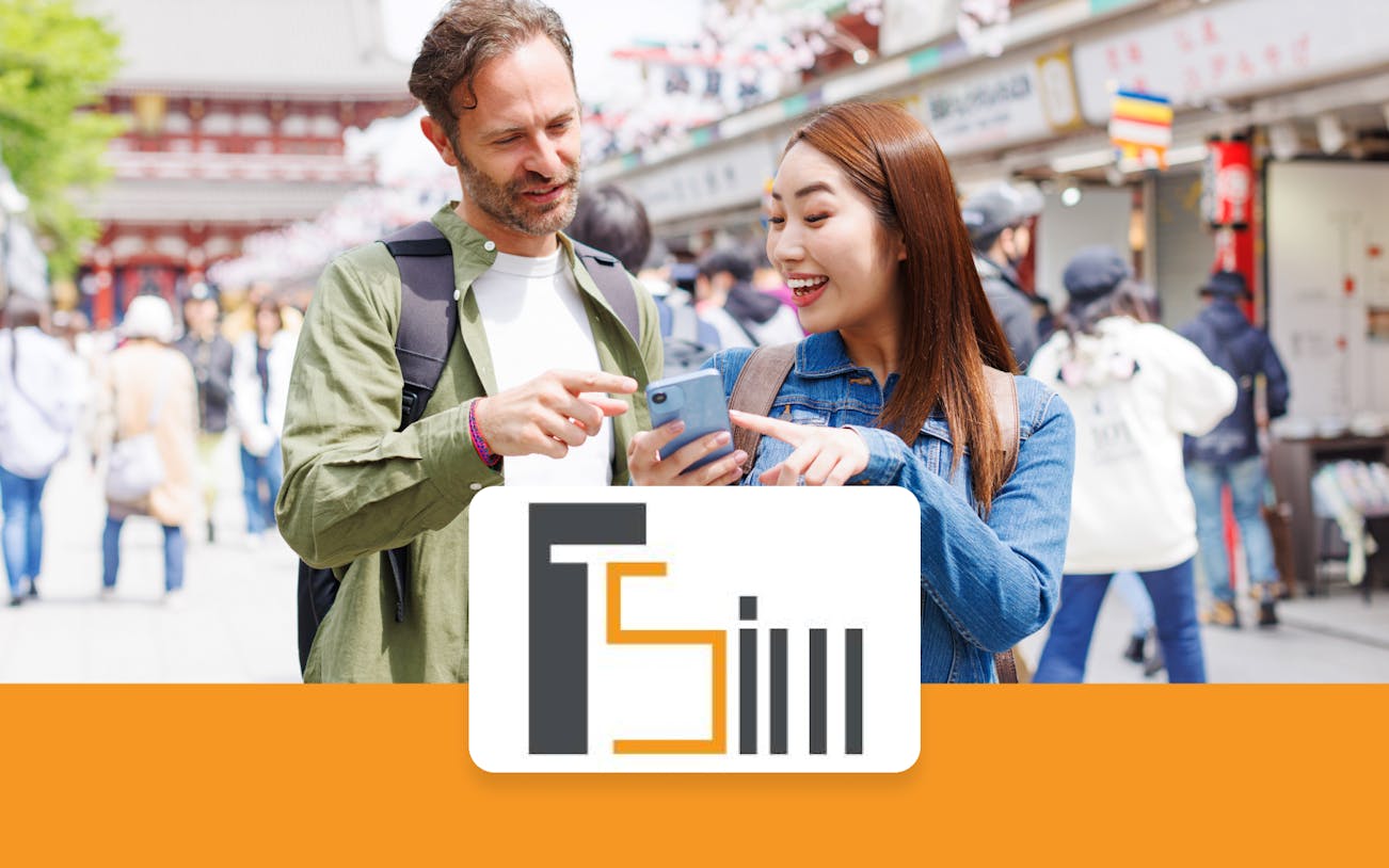 Tourists using a smartphone with a 4G eSIM card in Tokyo, Japan.