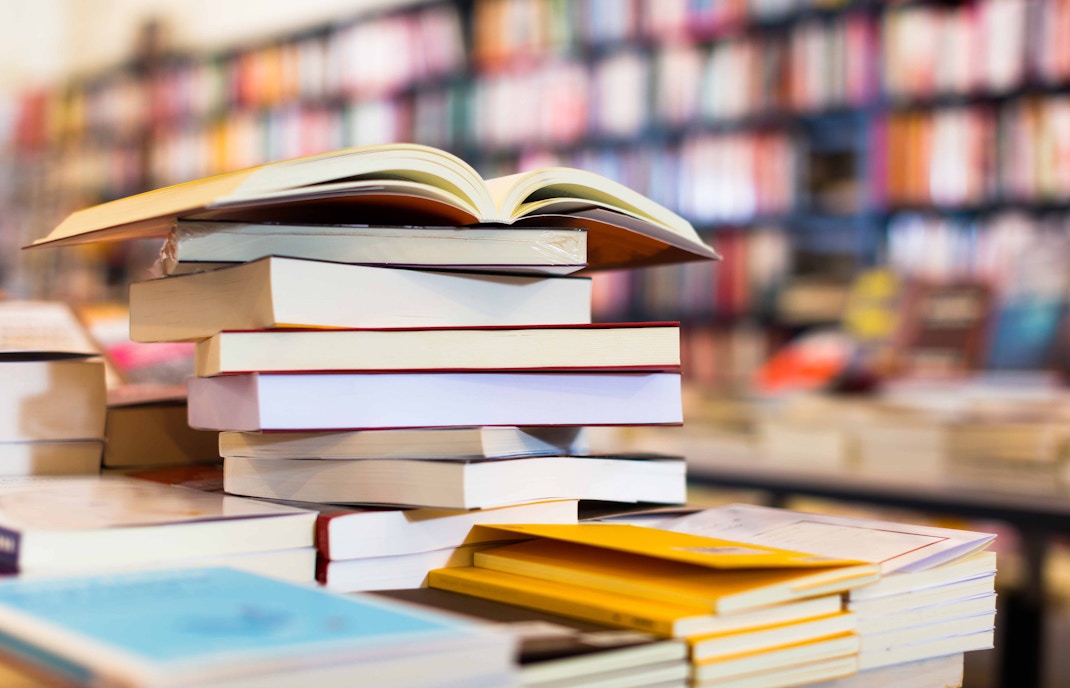Stack of art history books on display at the Uffizi Gallery bookshop, inviting visitors to delve deeper into the world of Renaissance art