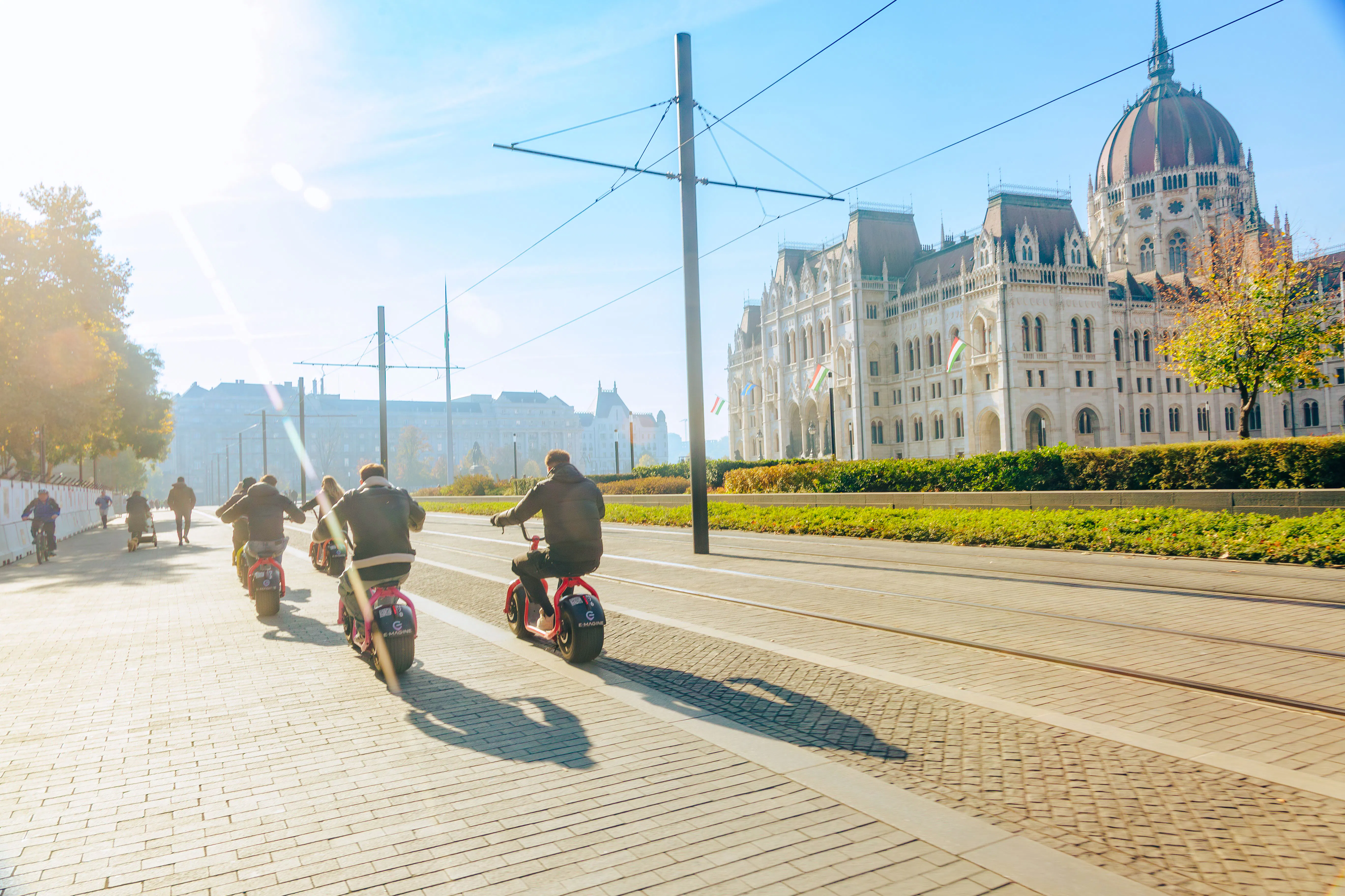E-scooter riders near the Hungarian Parliament Building in Budapest.