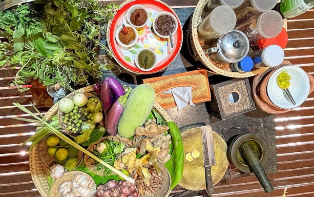 Thai cooking ingredients and spices on a table for a half-day guided cooking class and farm tour.