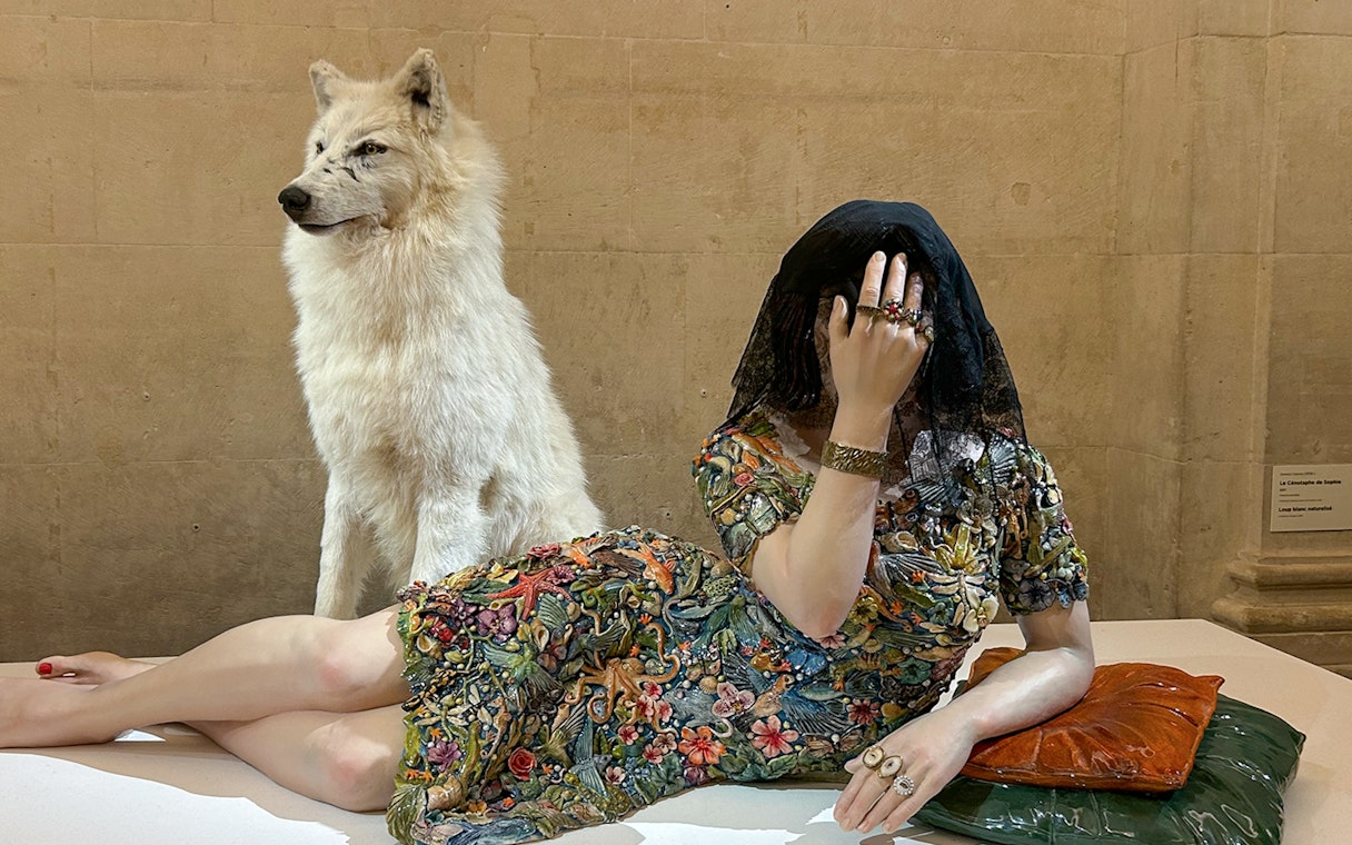 Sculpture of a veiled woman with a wolf at Picasso Museum, Barcelona.