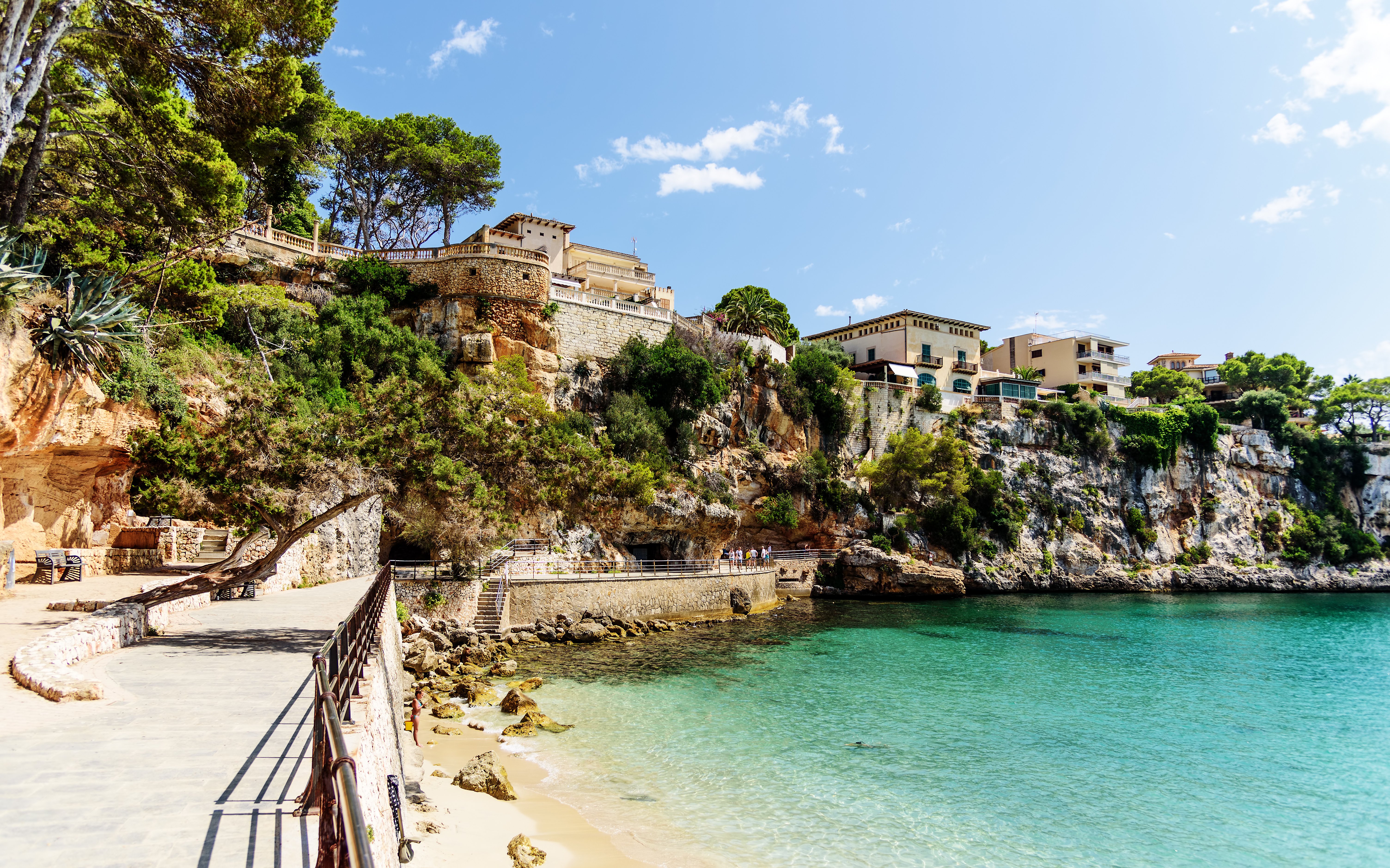 Coastal walkway and cliffs in Porto Cristo, Mallorca, Spain.