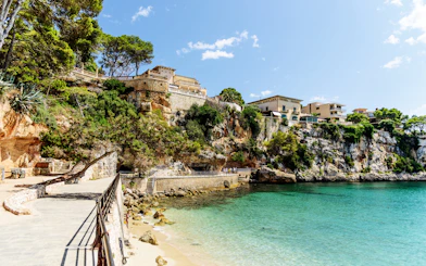 Coastal walkway and cliffs in Porto Cristo, Mallorca, Spain.