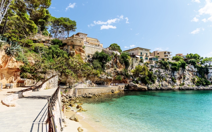 Coastal walkway and cliffs in Porto Cristo, Mallorca, Spain.