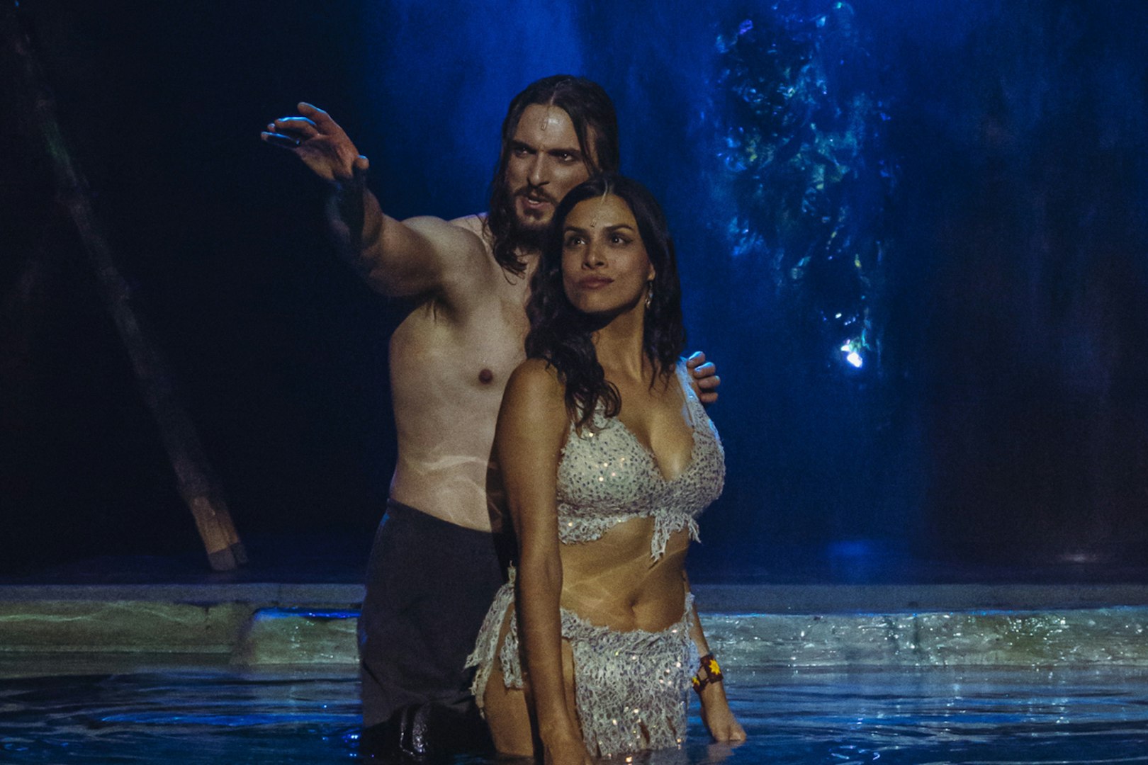 Performers in a scene from "MALINCHE, un musical de Nacho Cano" on stage.