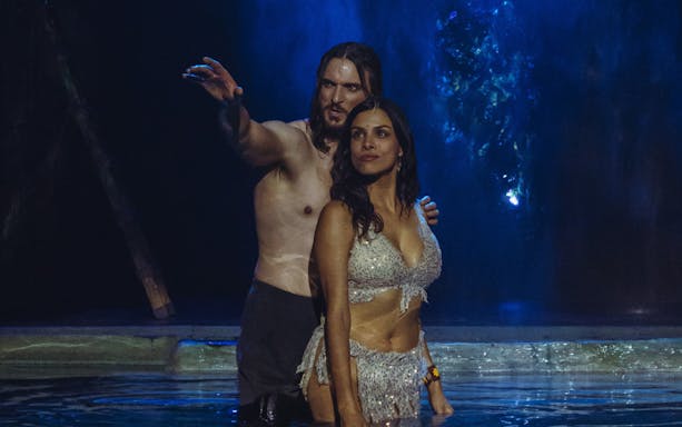 Performers in a scene from "MALINCHE, un musical de Nacho Cano" on stage.