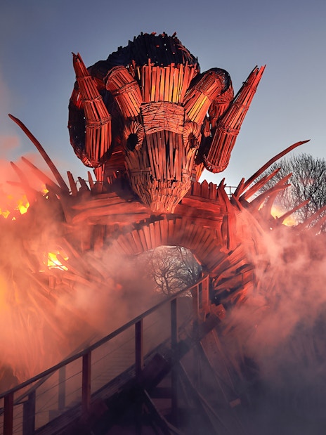 Wicker Man ride structure with flames and smoke at Alton Towers.