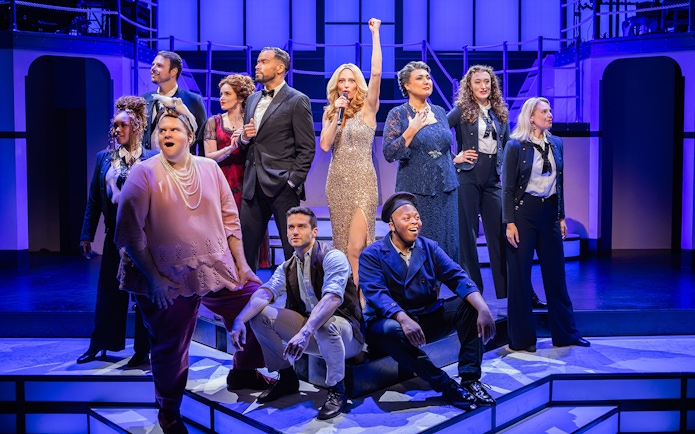 Cast of Titanique musical performing on stage.