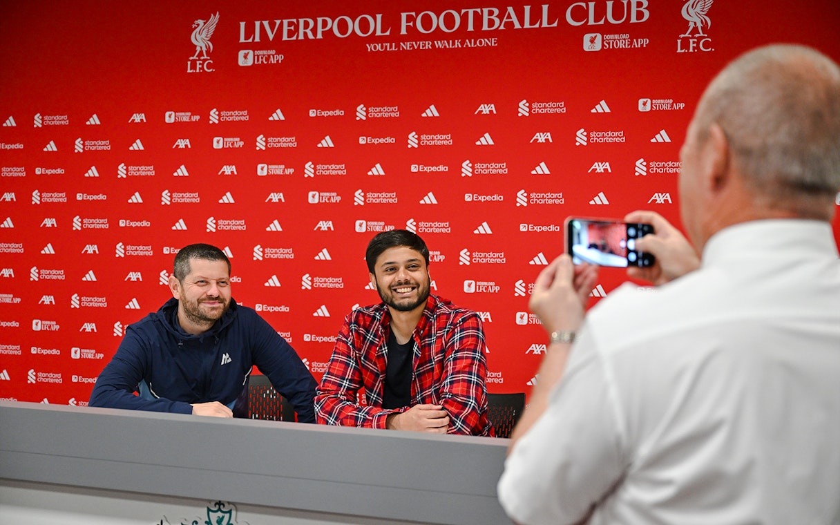 Two people at press room table, Anfield Arena, Liverpool FC.