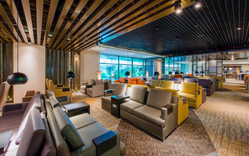 Changi Lounge seating area with modern decor and large windows, Singapore.