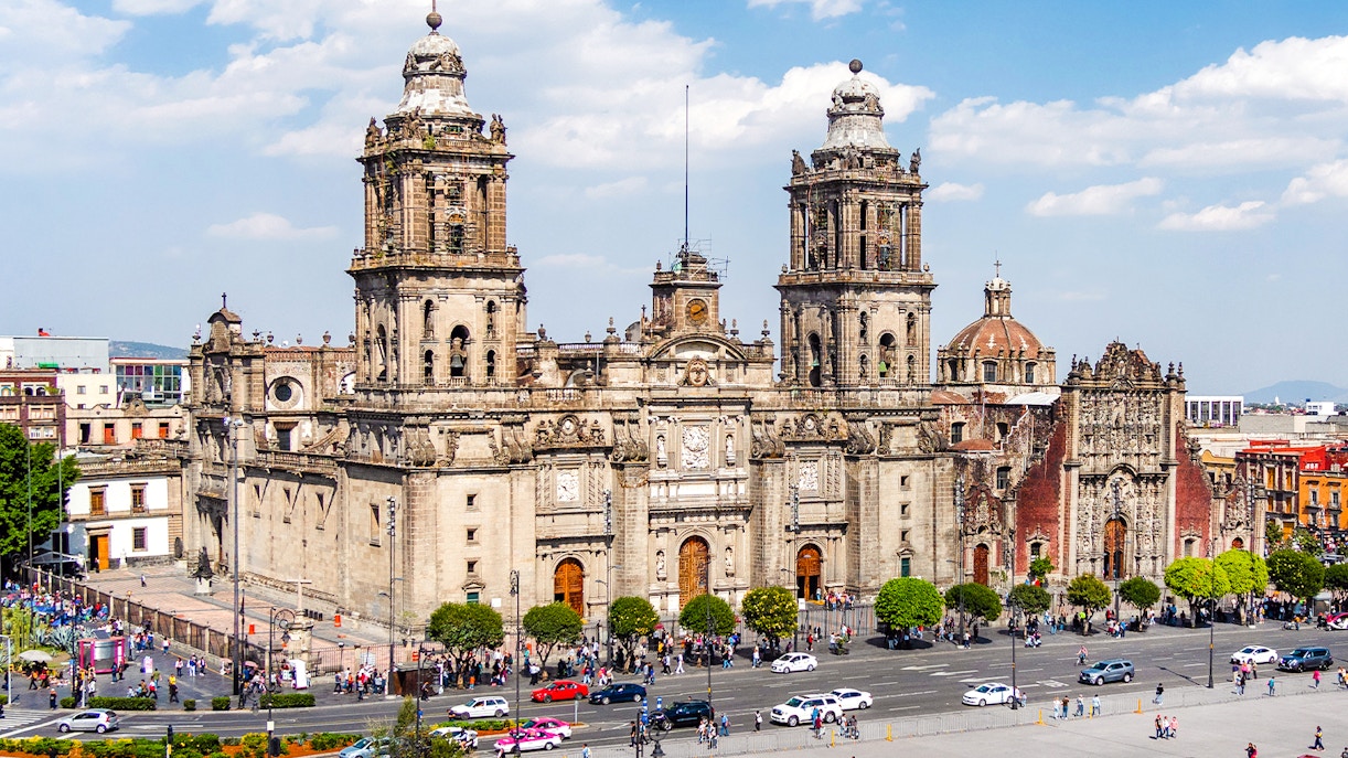 Metropolitan Cathedral facade with tourists in Historic Centre of Mexico City.
