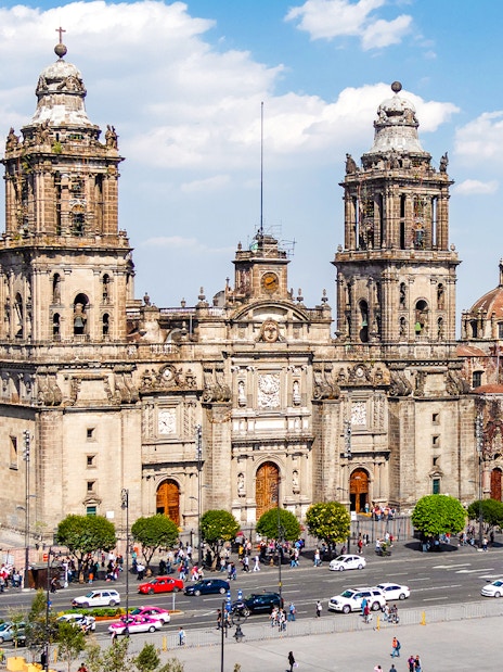 Metropolitan Cathedral facade with tourists in Historic Centre of Mexico City.