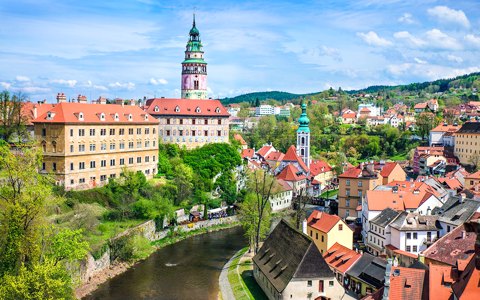 Český Krumlov cityscape with castle tower and Vltava River, Czech Republic.