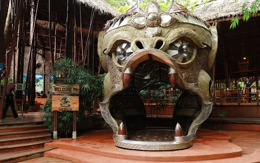 Entrance sculpture at Hanuman World, Phuket, featuring a large ornate monkey head.