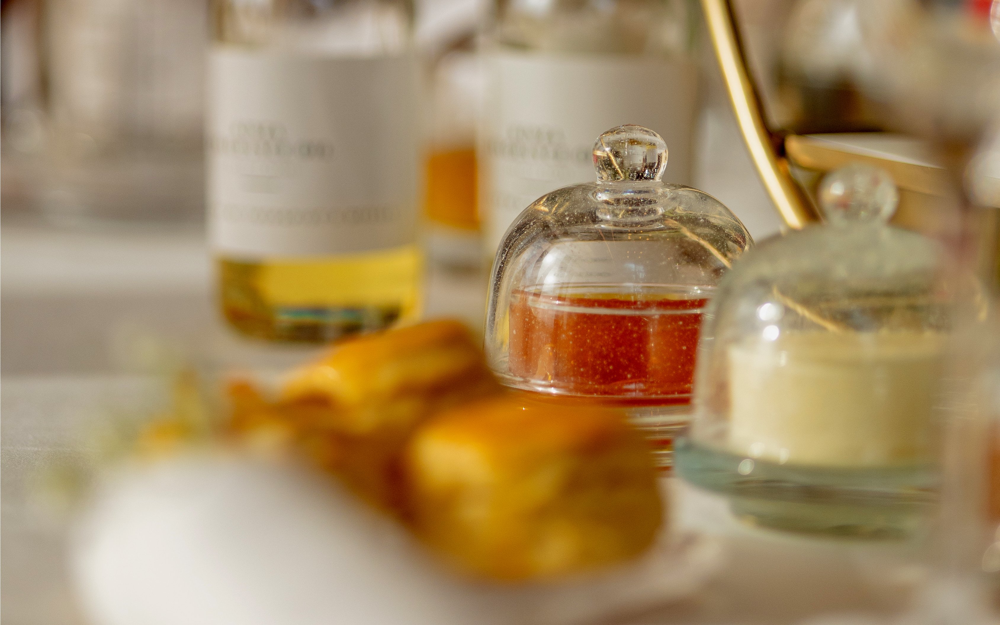 Afternoon tea setup with pastries and preserves at The Samovar Lounge, Dubai.
