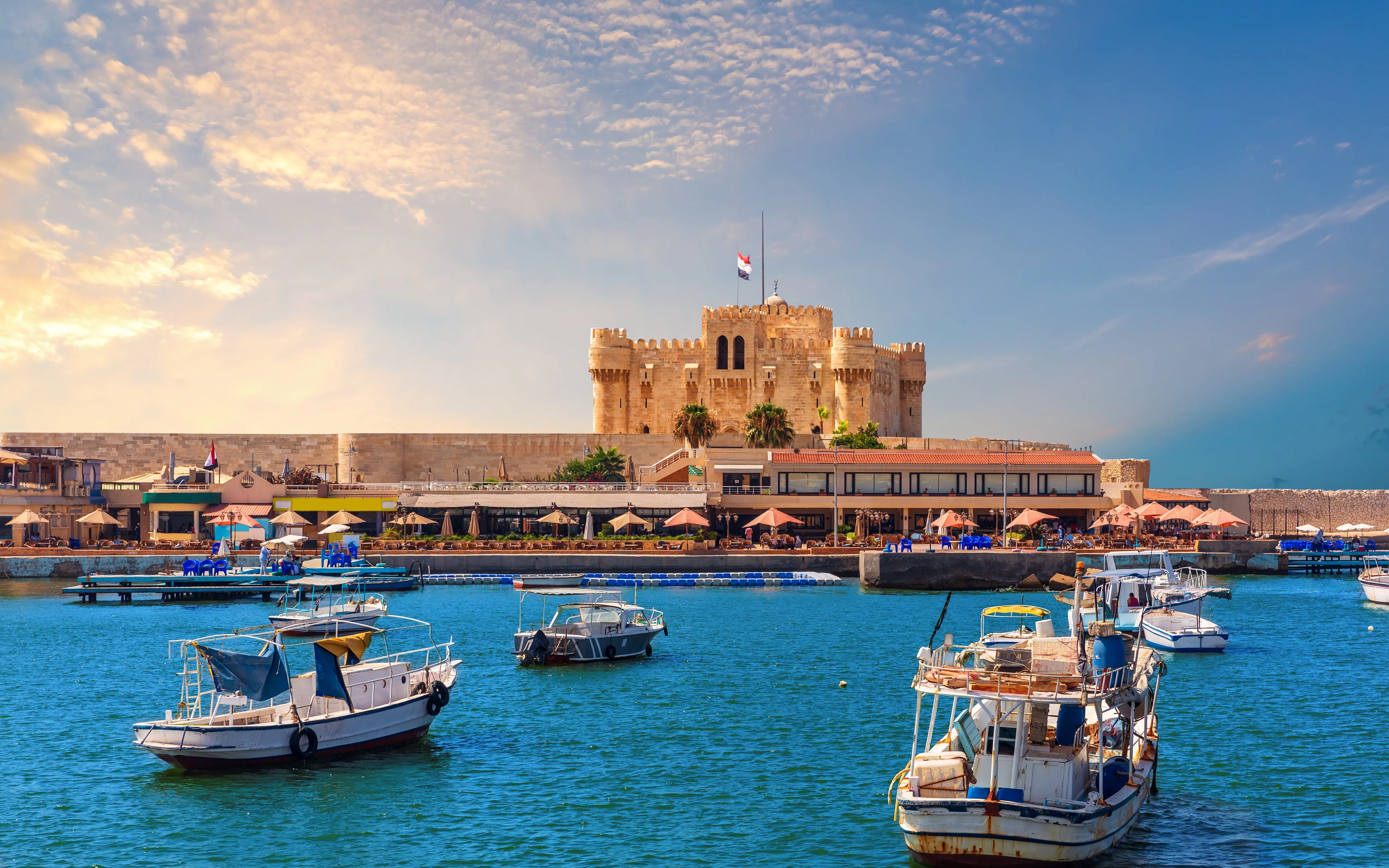 Boats in the harbor near Citadel of Qaitbay, Alexandria, Egypt.