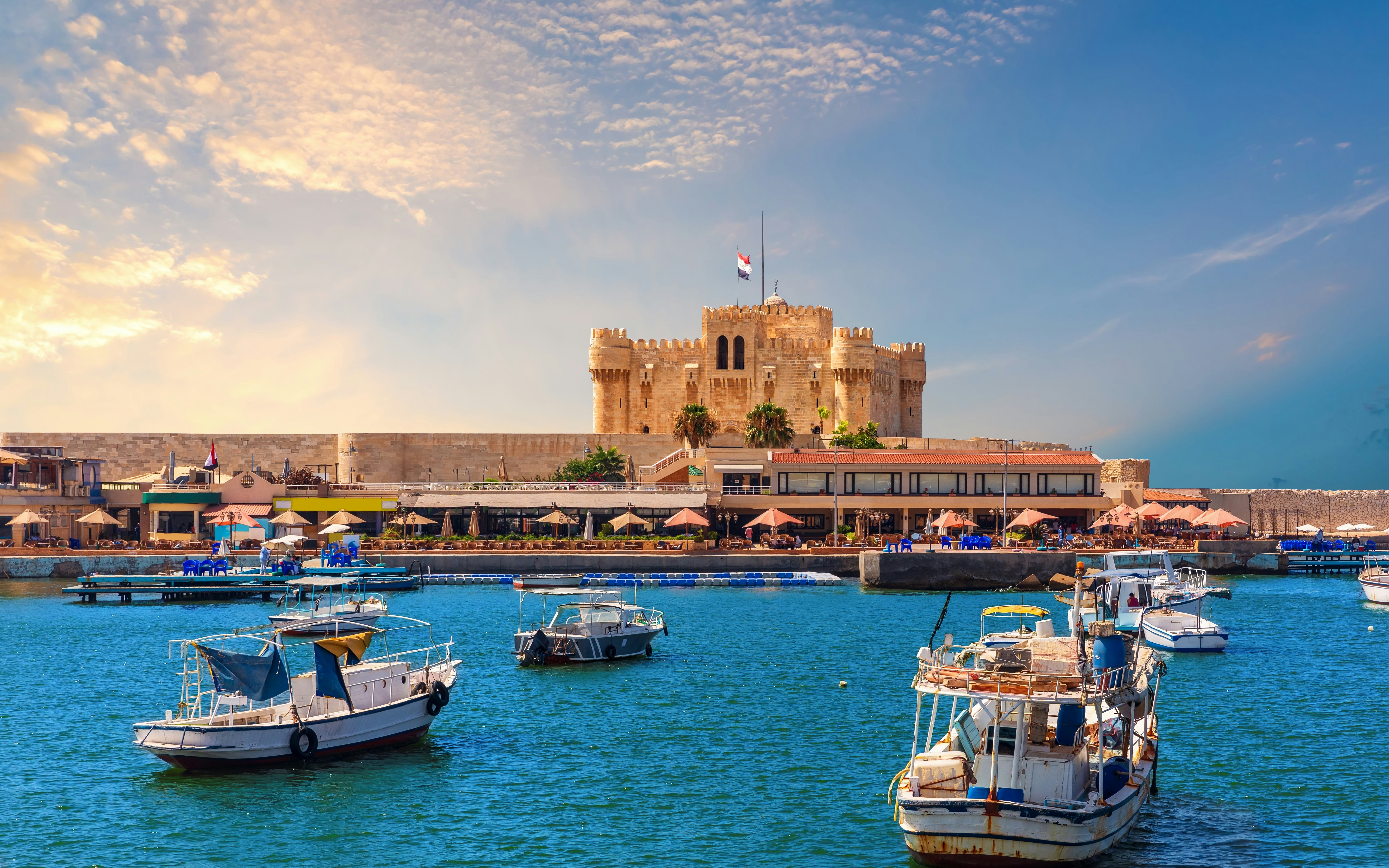 Boats in the harbor near Citadel of Qaitbay, Alexandria, Egypt.