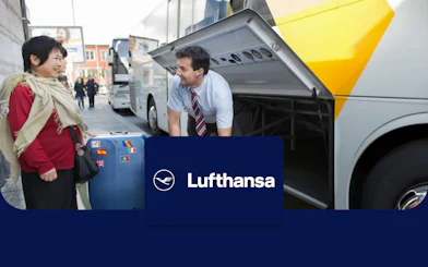 Lufthansa bus loading luggage for round-trip Munich Airport transfer.