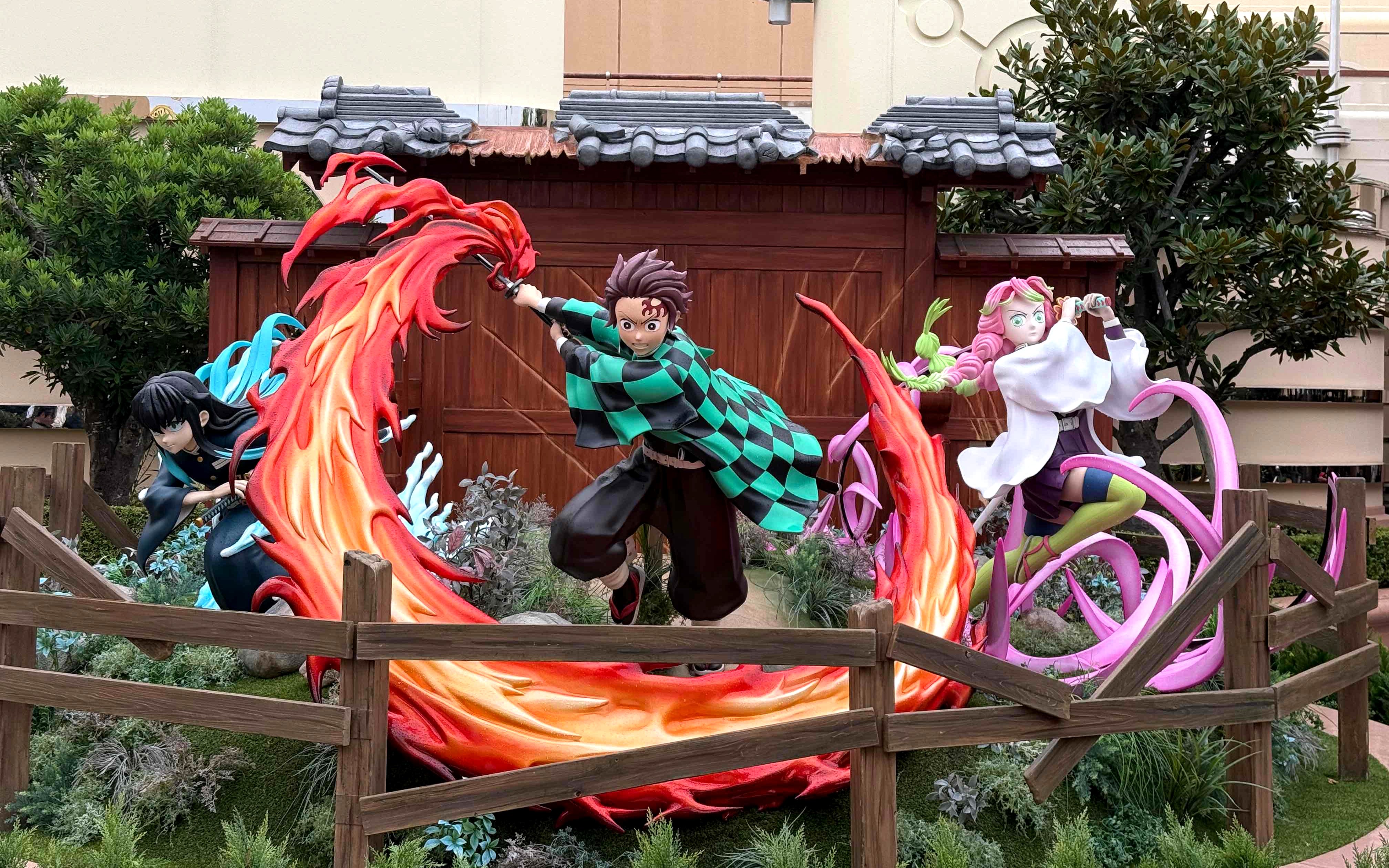 Characters from an anime series in action poses at Universal Studios Japan.