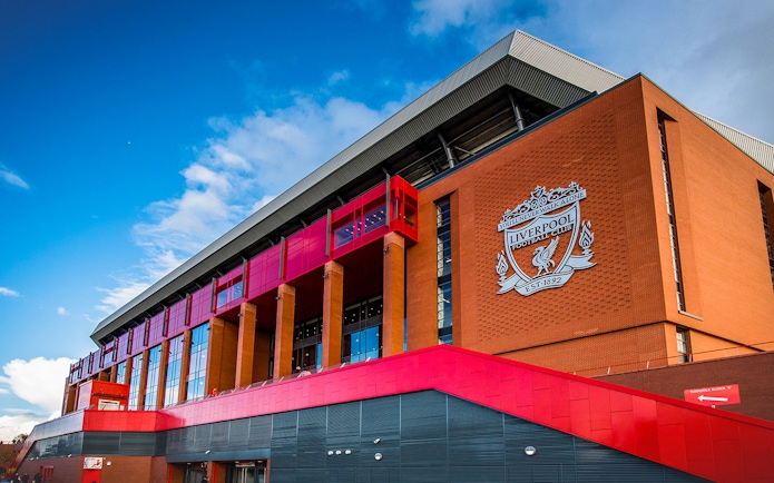 Liverpool FC stadium exterior with club crest, part of Legends Q&A and Stadium Tour.